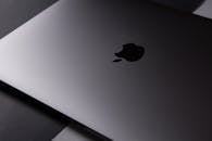Minimalist photo of a sleek black laptop from a top view highlighting its modern design.